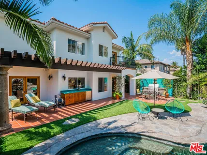 a front view of house with yard and outdoor seating