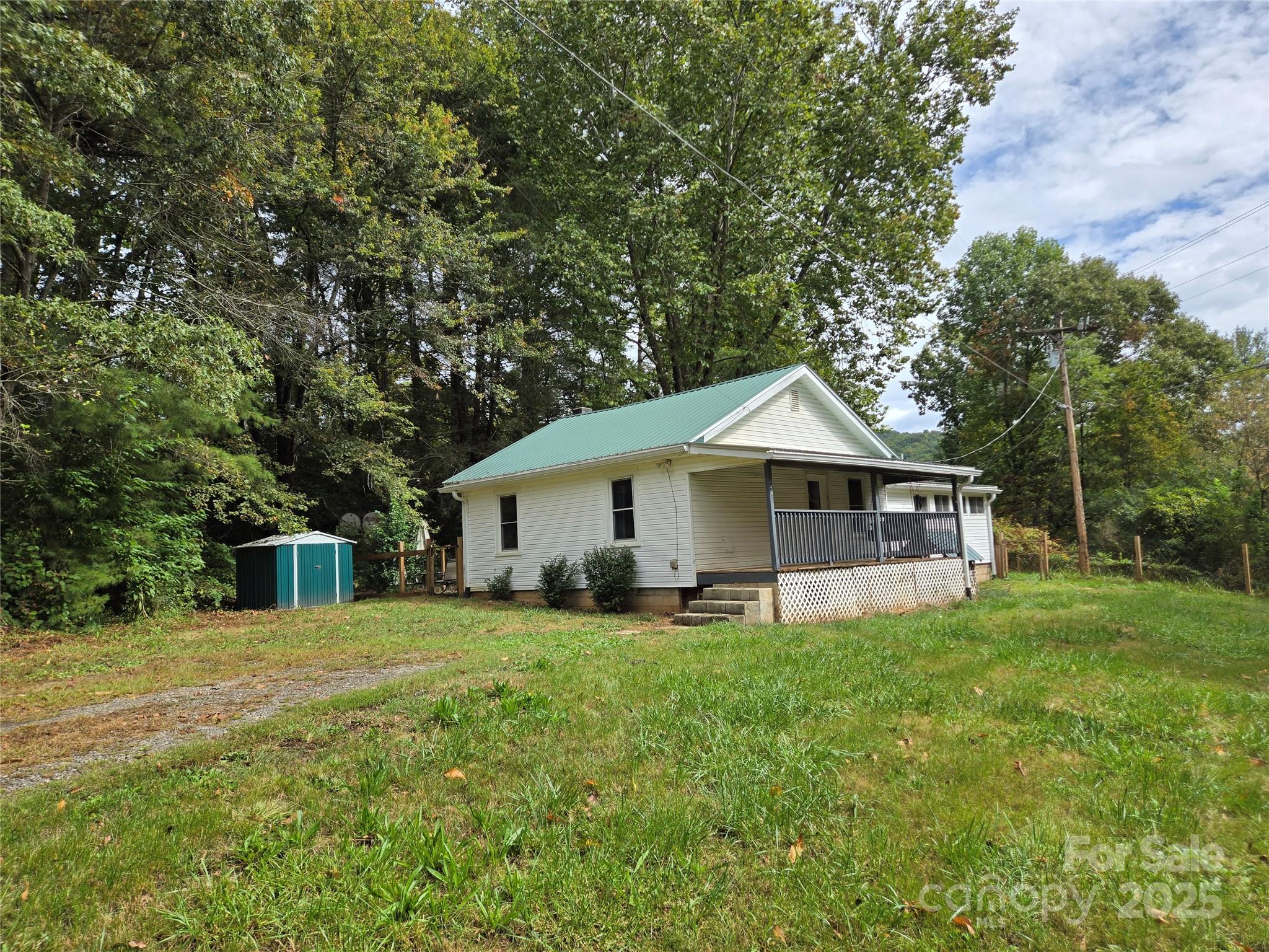 148 Huffman Road Clyde, NC 28721 - Photo 1 of 46 a view of a house with a yard