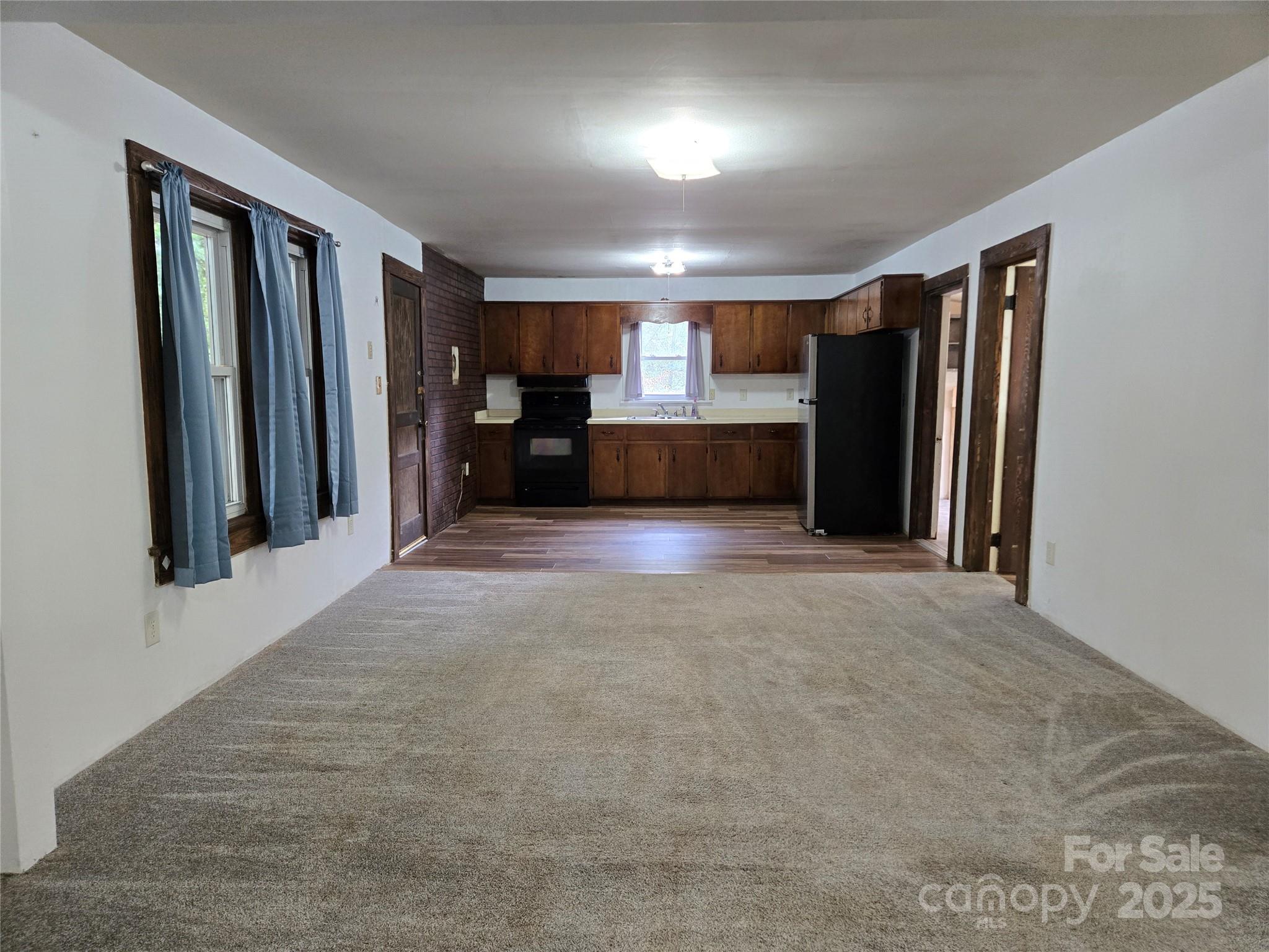 148 Huffman Road Clyde, NC 28721 - Photo 12 of 46 a view of a hallway with a kitchen