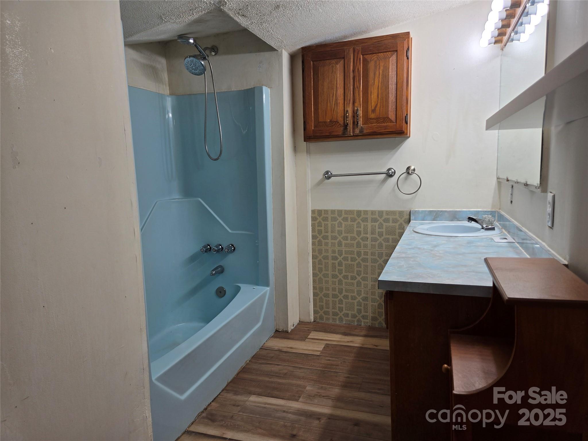 148 Huffman Road Clyde, NC 28721 - Photo 23 of 46 a bathroom with a sink and a mirror