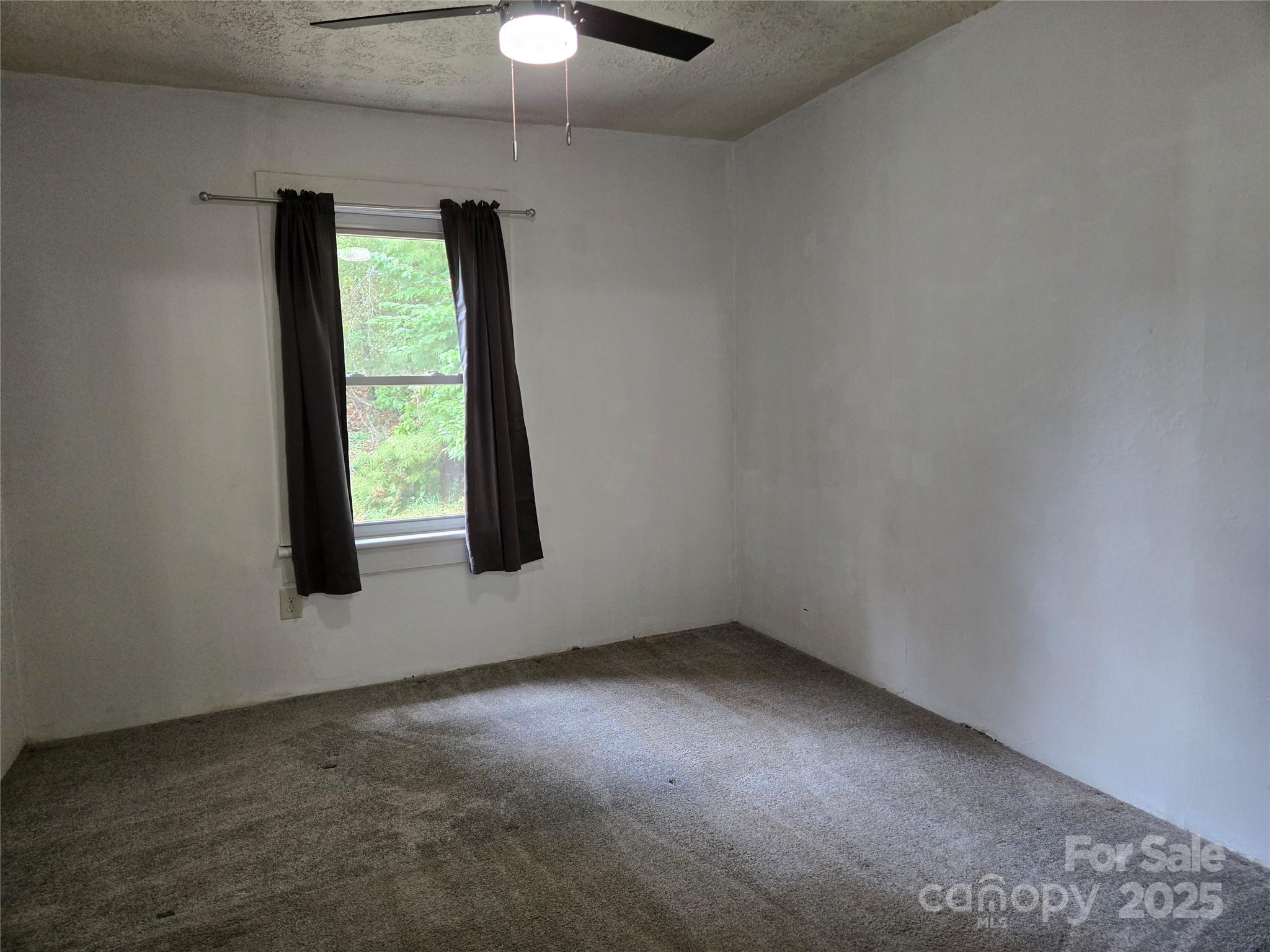 148 Huffman Road Clyde, NC 28721 - Photo 29 of 46 an empty room with a window