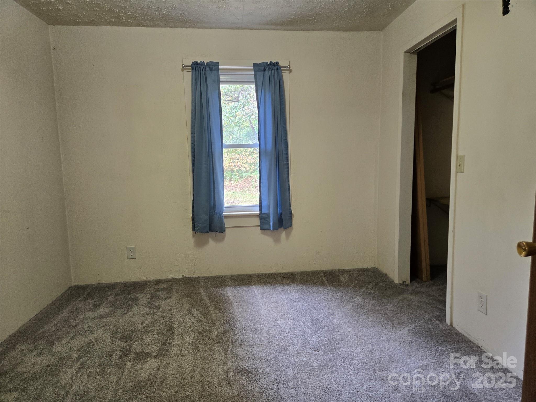 148 Huffman Road Clyde, NC 28721 - Photo 31 of 46 an empty room with windows
