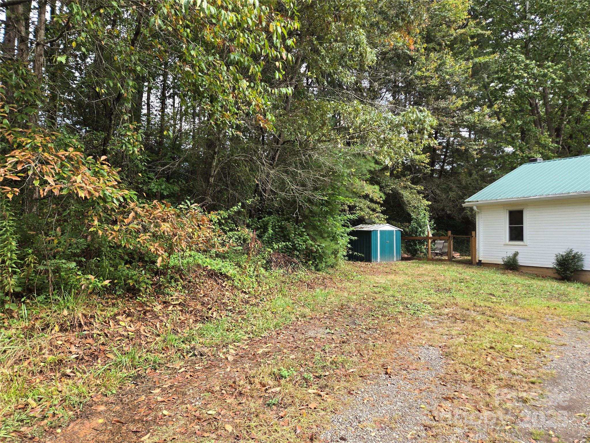 148 Huffman Road Clyde, NC 28721 - Photo 4 of 46 a house with a tree in front of it