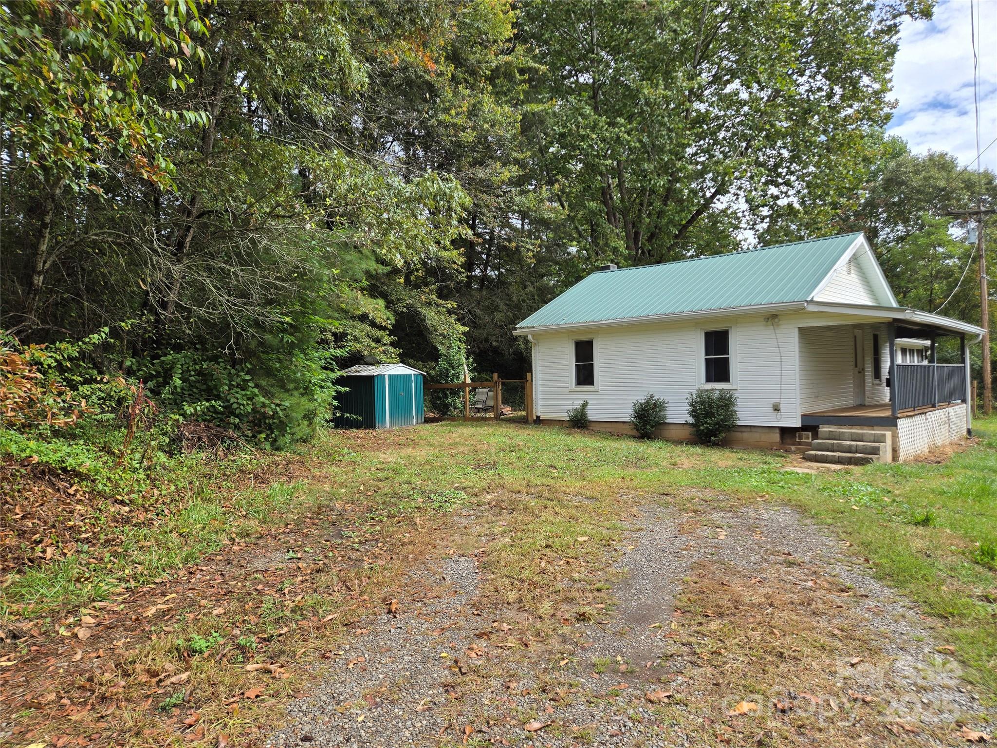 148 Huffman Road Clyde, NC 28721 - Photo 46 of 46 a view of a house with backyard and garden