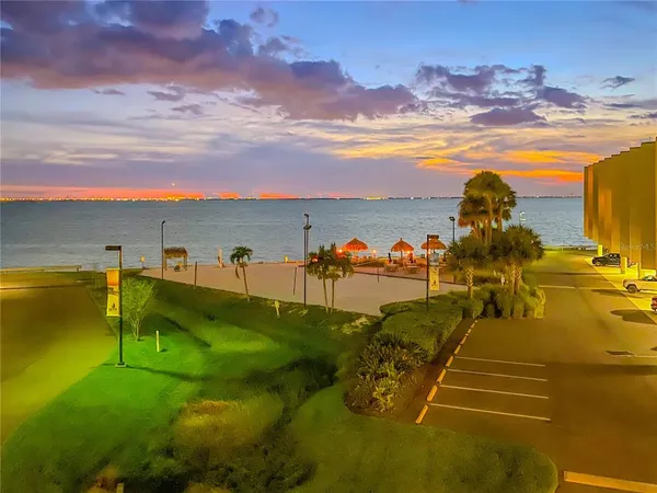 a living room with furniture and a dining table