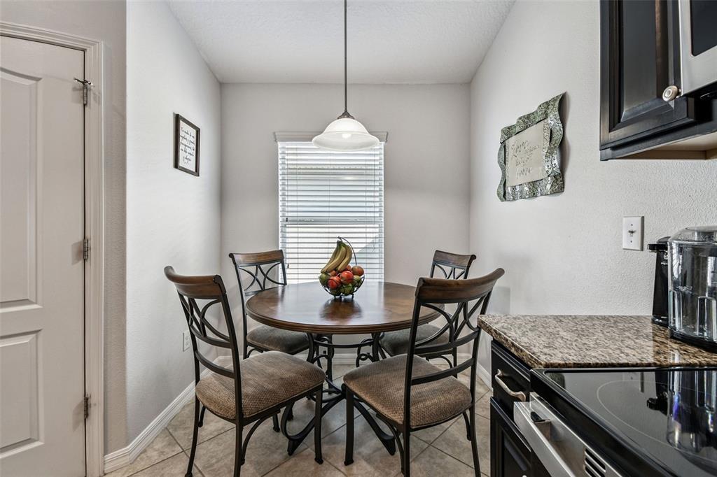 8439 Hunters Fork Loop Ruskin, FL 33573 - Photo 20 of 74 a dining room with furniture and window