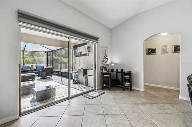 an aerial view of residential houses with outdoor space and lake view