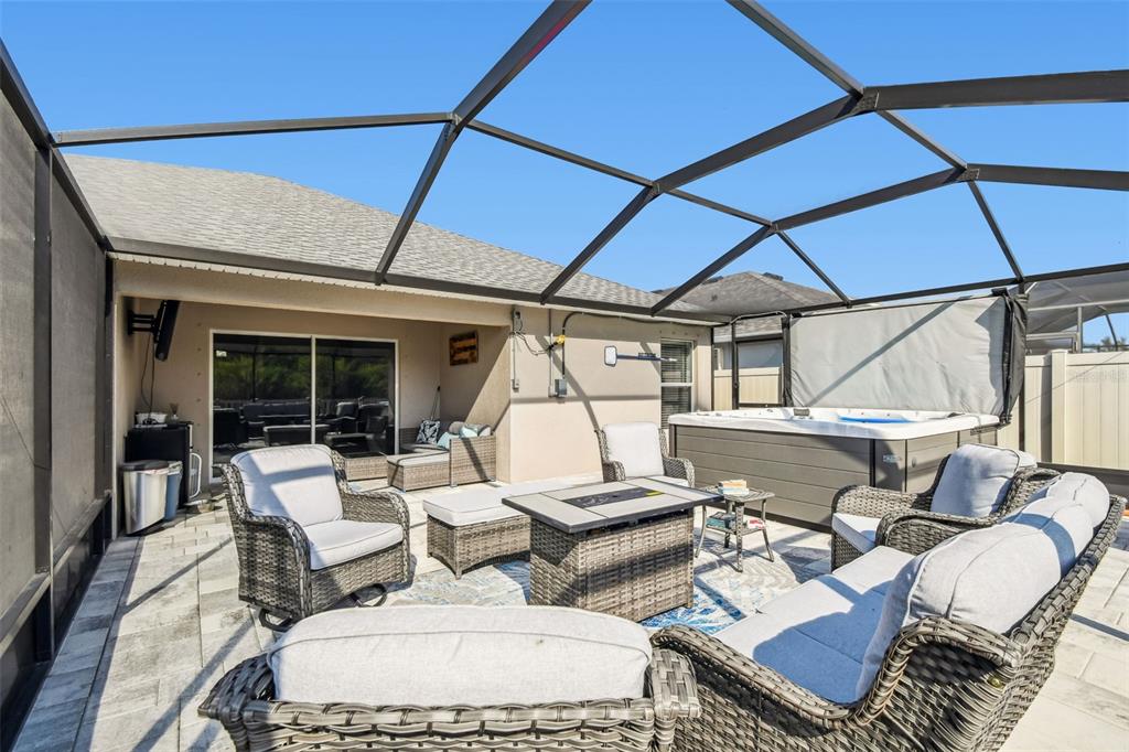 8439 Hunters Fork Loop Ruskin, FL 33573 - Photo 46 of 74 a view of a patio with couches and table and chairs
