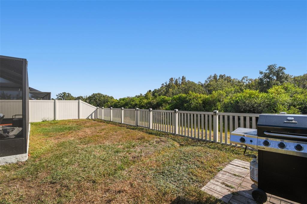 8439 Hunters Fork Loop Ruskin, FL 33573 - Photo 49 of 74 a view of a backyard with wooden fence