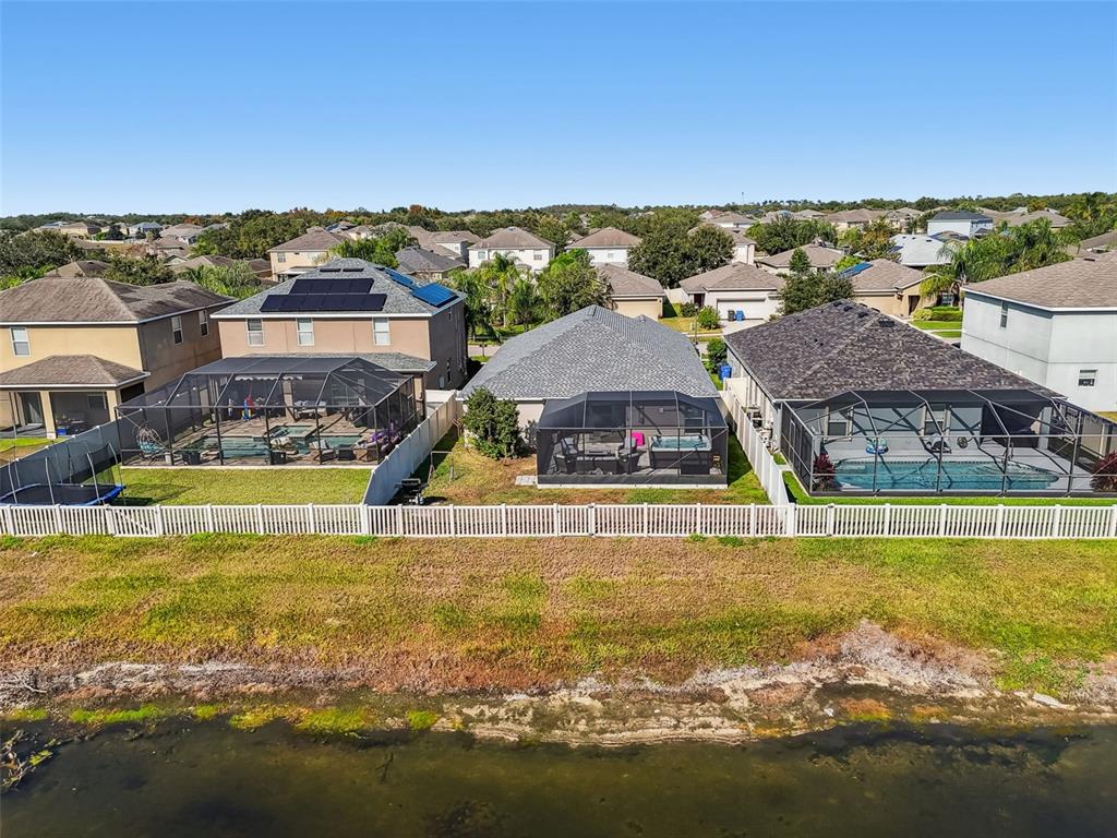 8439 Hunters Fork Loop Ruskin, FL 33573 - Photo 64 of 74 a view of a swimming pool with lawn chairs