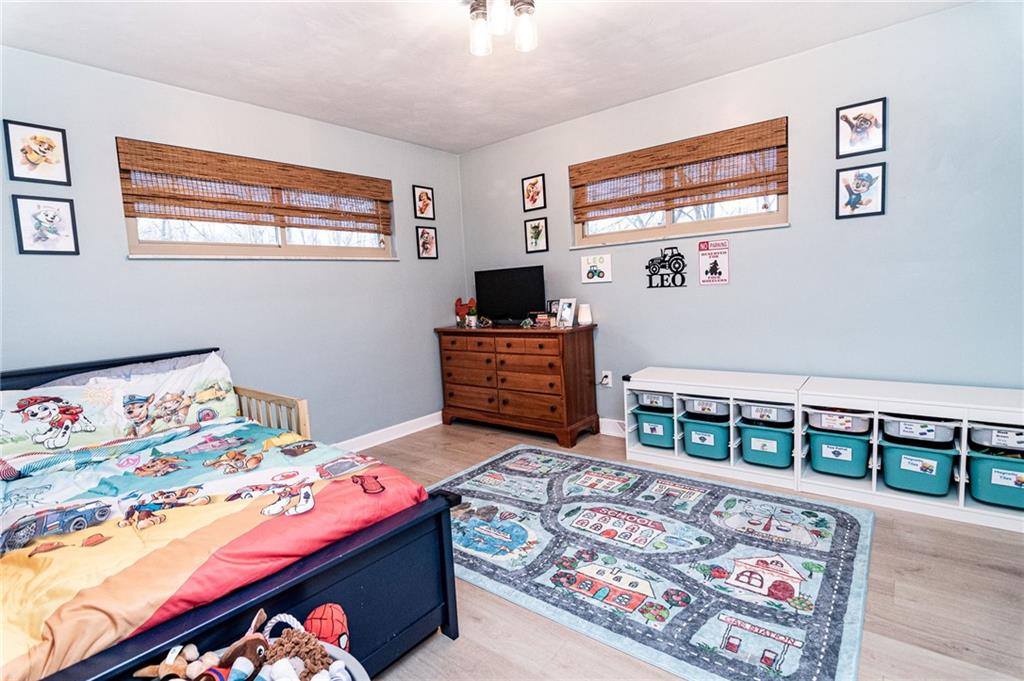 1005 Paintertown Road Irwin, PA 15642 - Photo 17 of 33 a bedroom with a bed and a dresser in it