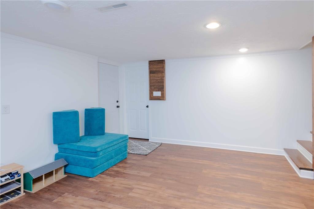 1005 Paintertown Road Irwin, PA 15642 - Photo 20 of 33 a room with stairs and a chair