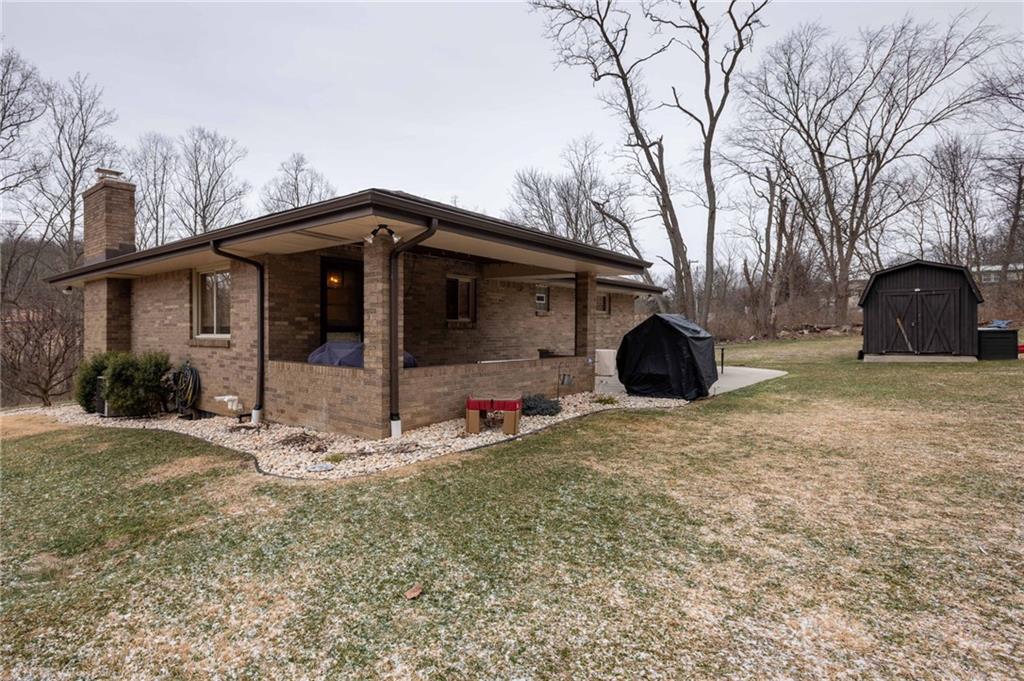 1005 Paintertown Road Irwin, PA 15642 - Photo 29 of 33 a view of a house with backyard and trees