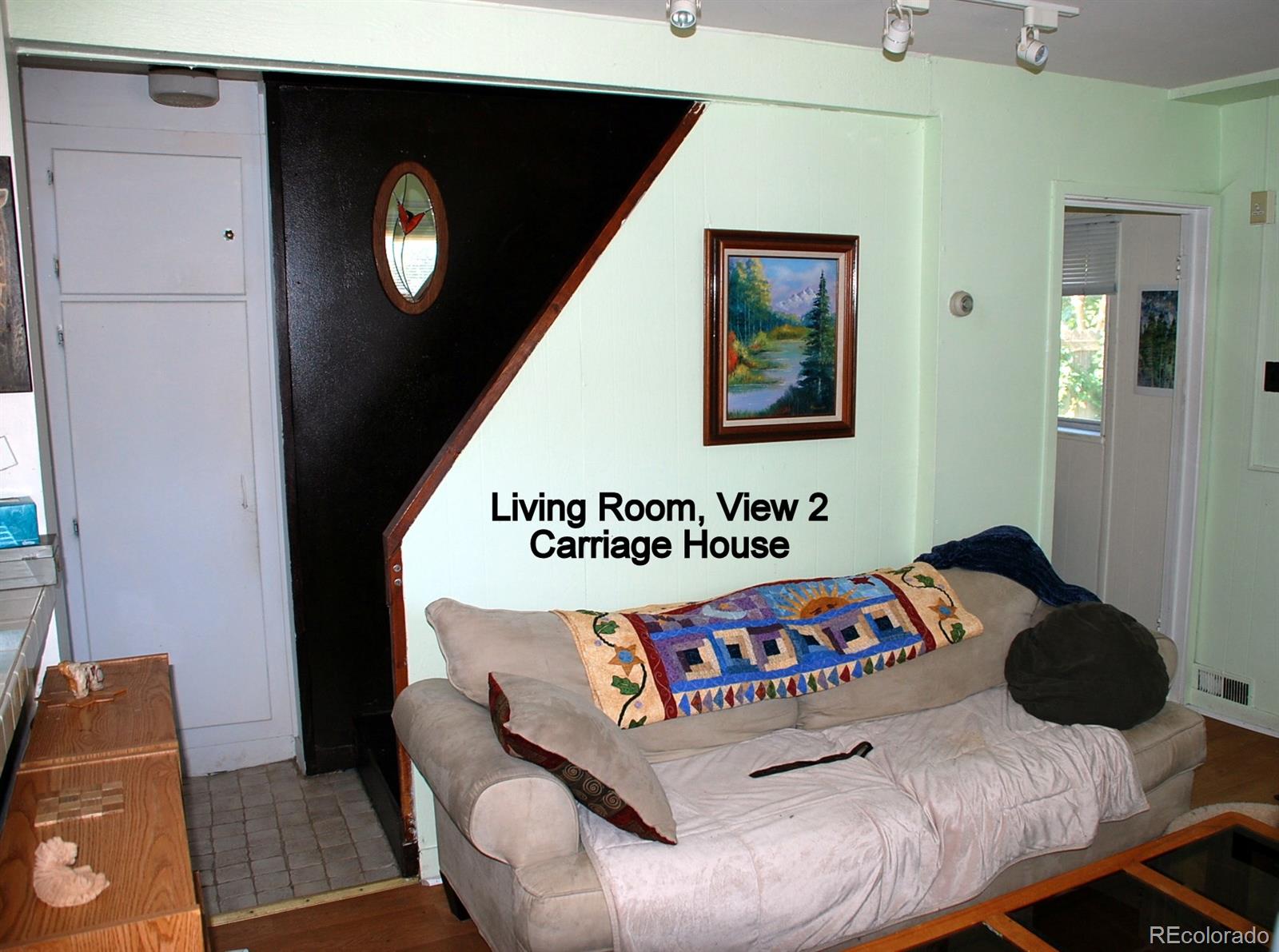 2860 Chase Street Wheat Ridge, CO 80214 - Photo 13 of 17 a bedroom with a bed and a couch