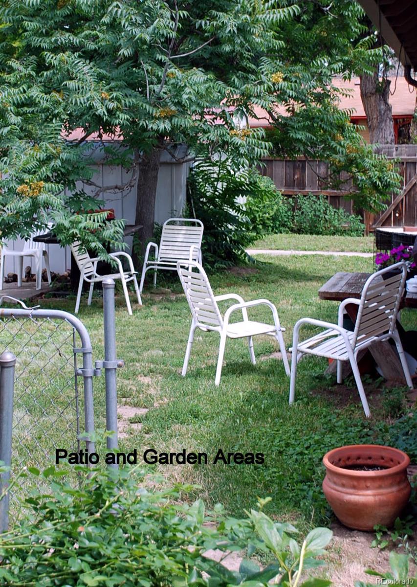 2860 Chase Street Wheat Ridge, CO 80214 - Photo 17 of 17 a view of a chairs and table in backyard