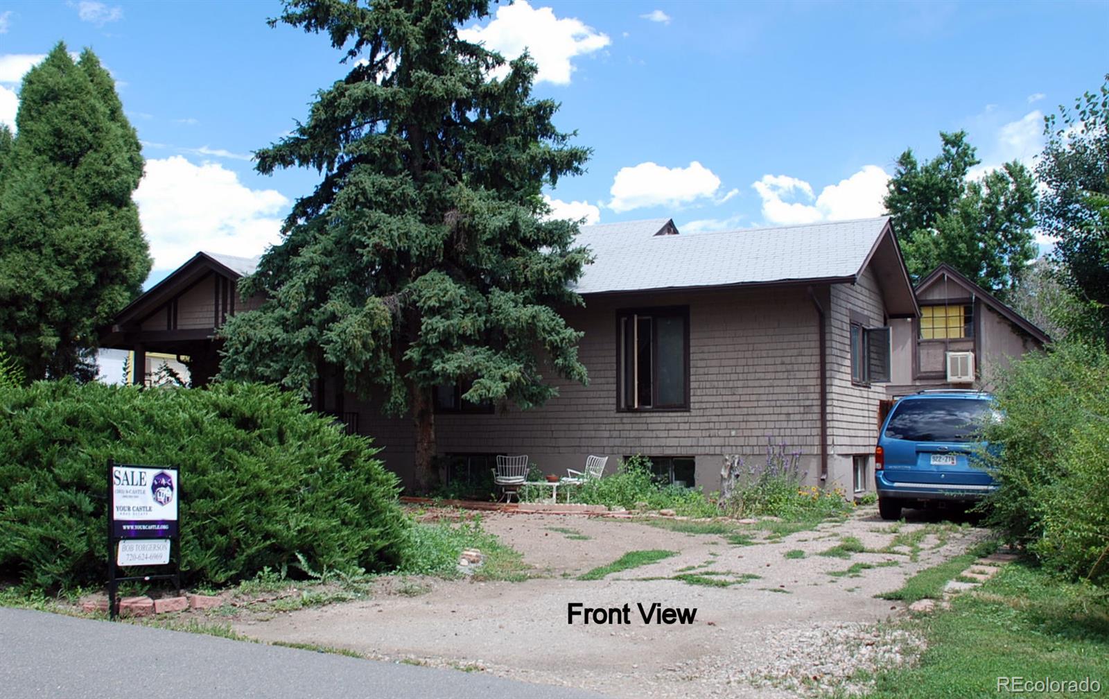 2860 Chase Street Wheat Ridge, CO 80214 - Photo 2 of 17 a front view of a house with garden