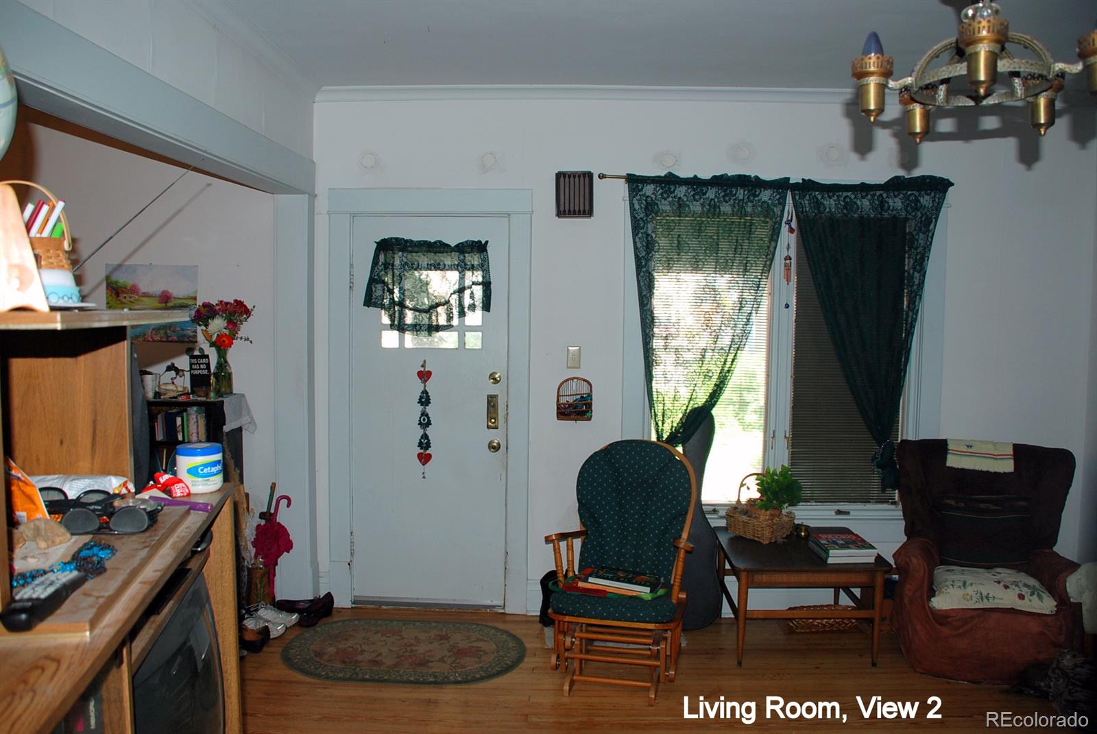 2860 Chase Street Wheat Ridge, CO 80214 - Photo 5 of 17 a room with furniture and a window