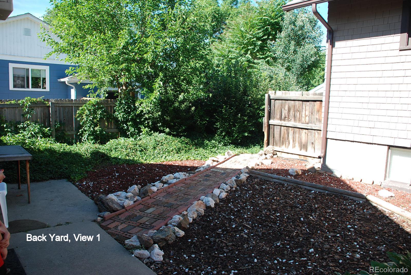 2860 Chase Street Wheat Ridge, CO 80214 - Photo 9 of 17 a view of a house with a yard