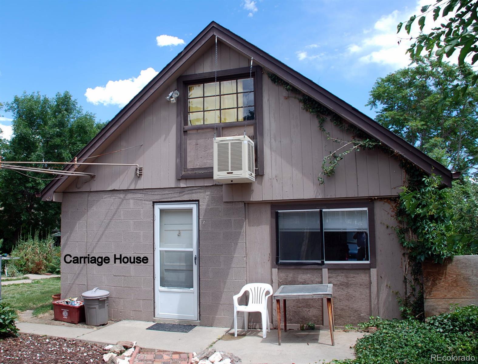 2860 Chase Street Wheat Ridge, CO 80214 - Photo 10 of 17 a front view of a house with garden
