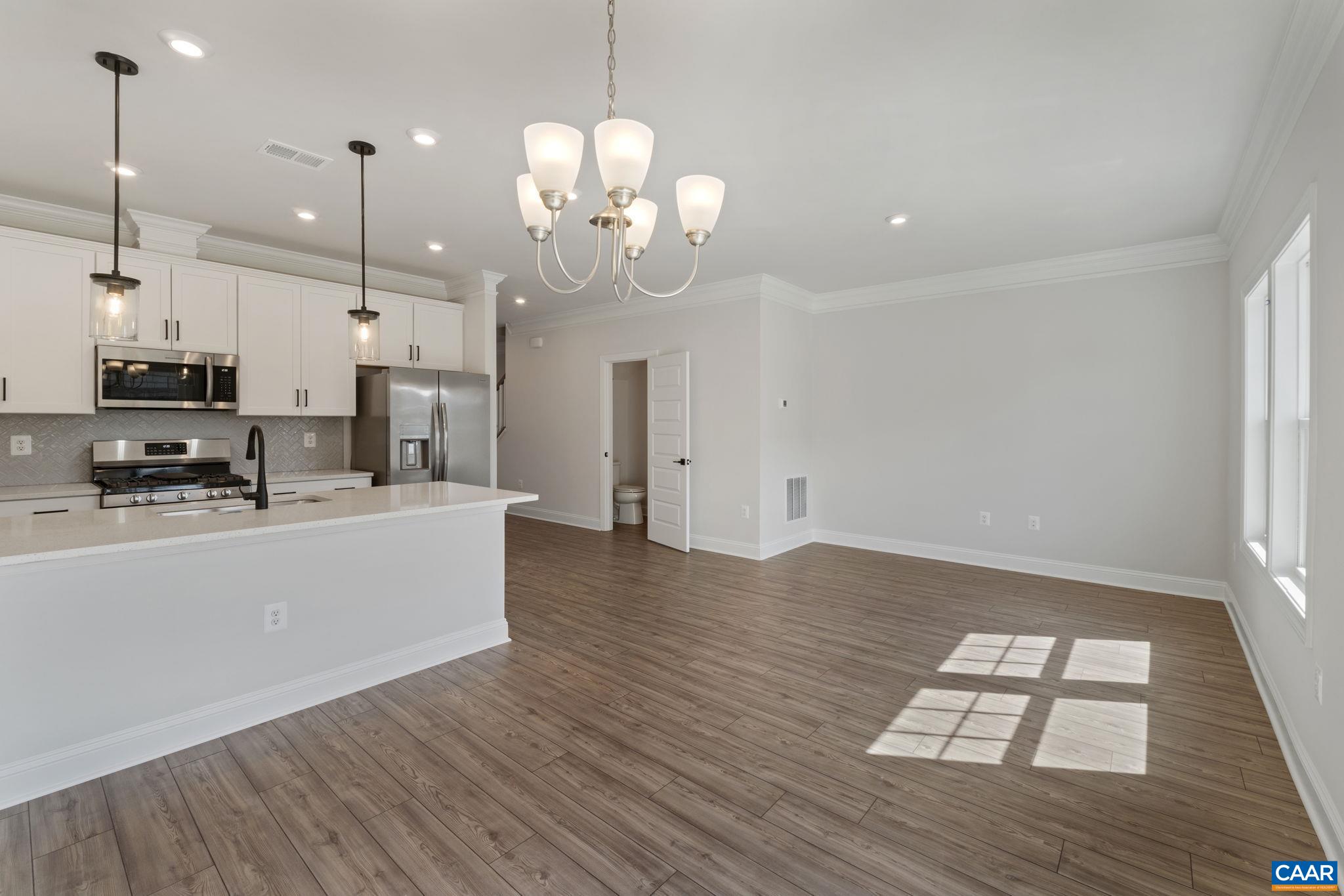313 Ridgeline Drive Waynesboro, VA 22980 - Photo 19 of 34 a view of a kitchen with wooden floor and a chandelier