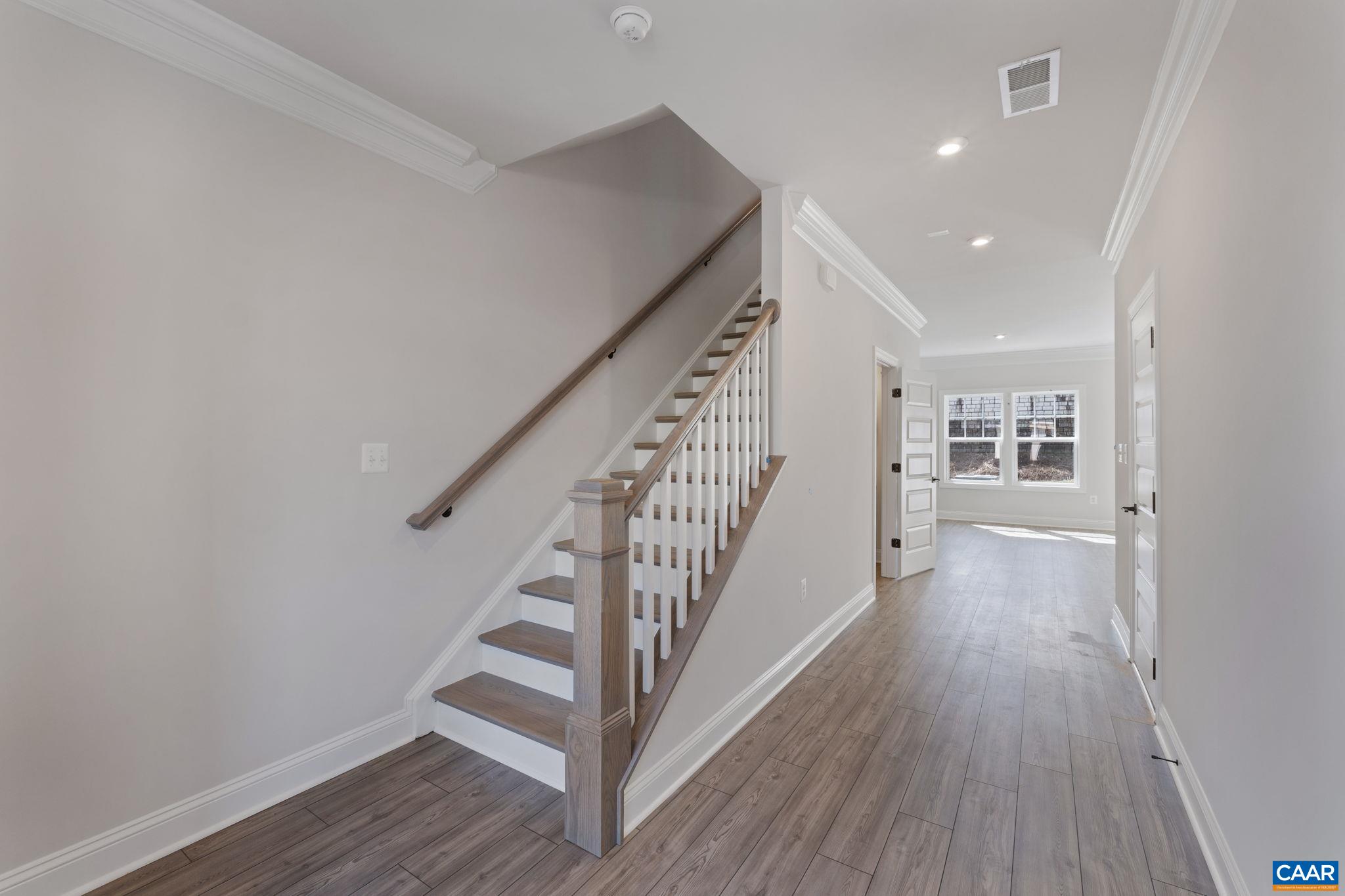 313 Ridgeline Drive Waynesboro, VA 22980 - Photo 5 of 34 a view of a hallway with wooden floor and workspace