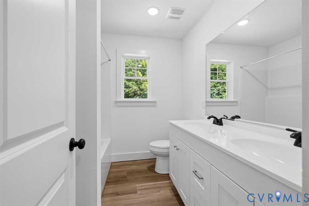 654 Frenchs Store Road Cumberland, VA 23040 - Photo 12 of 24 Bathroom featuring a dual vanity with white cabine