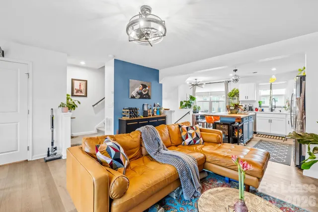 a kitchen with stainless steel appliances granite countertop a sink a stove and a refrigerator