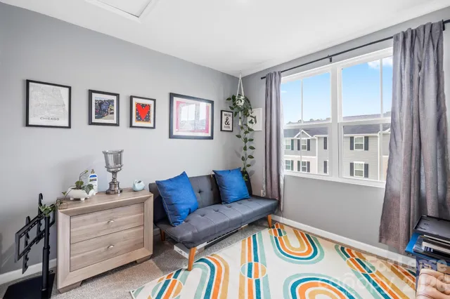 a view of a patio with couches table and chairs and potted plants