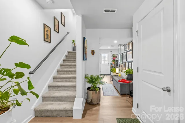 a living room filled with furniture and book shelf