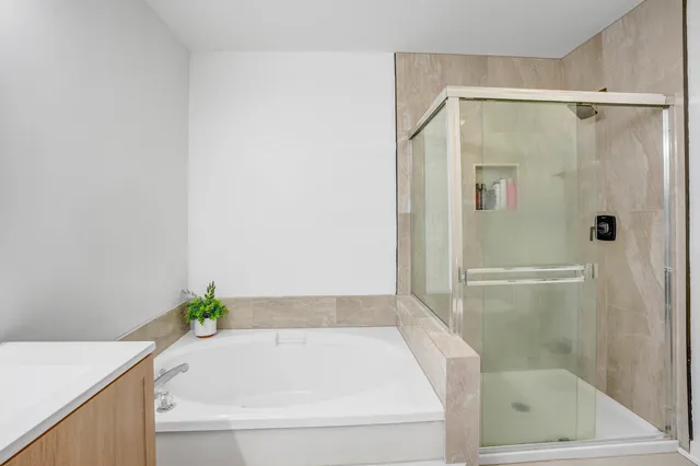 a bathroom with a bathtub and shower