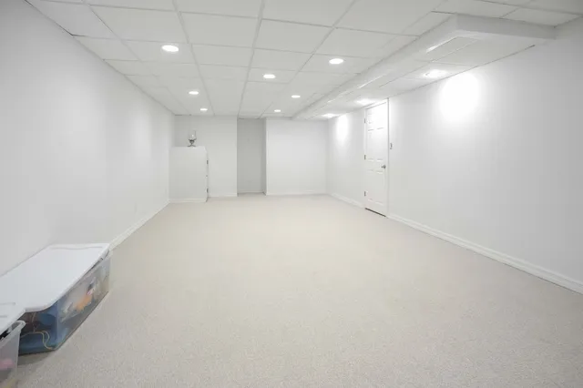 an empty room with a kitchen