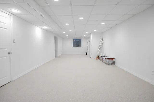 an empty room with a kitchen