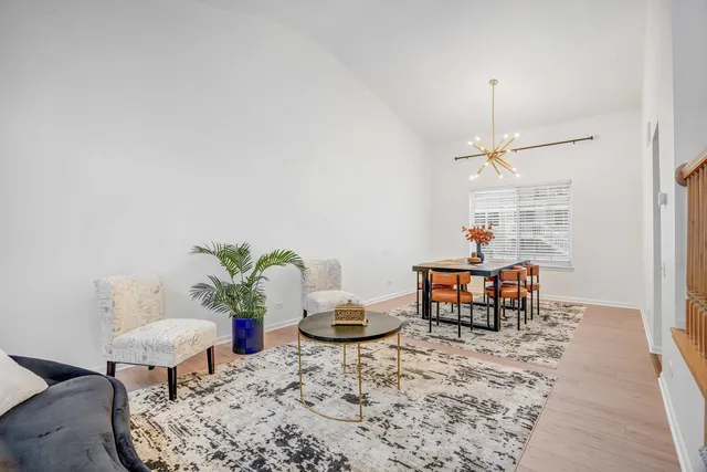 a living room with furniture and a table