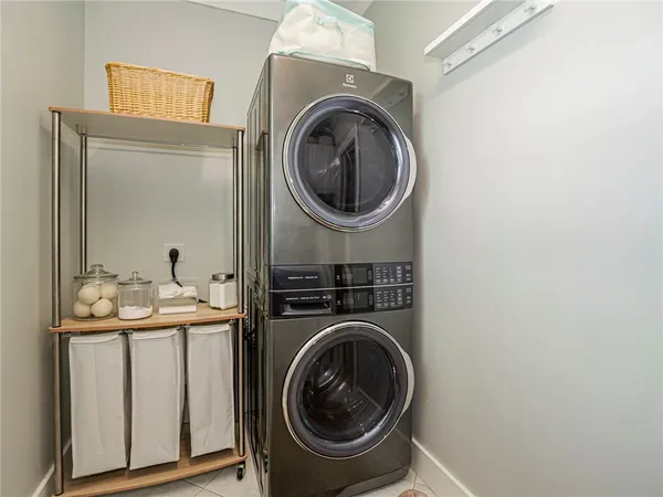 a utility room with sink dryer and washer