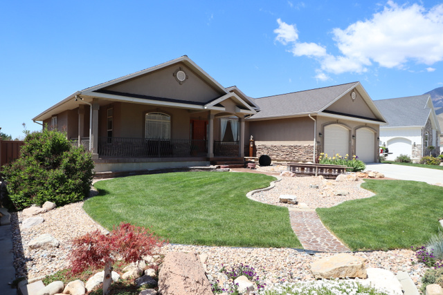 1055 North 1000 East Mapleton, UT 84664 - Photo 111 of 112 Stucco exterior featuring a covered porch with columns and wrought iron railing