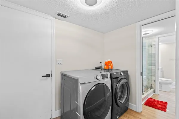 a utility room with dryer and washer