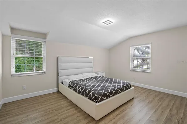 a room with a bed and a window in it