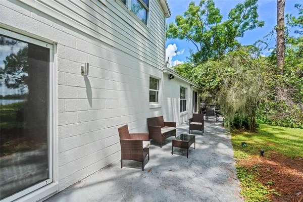 a view of a patio with chairs and a table and chairs
