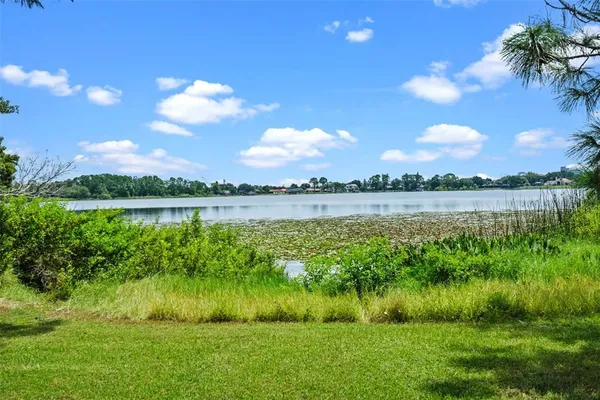 a view of a lake with a big yard