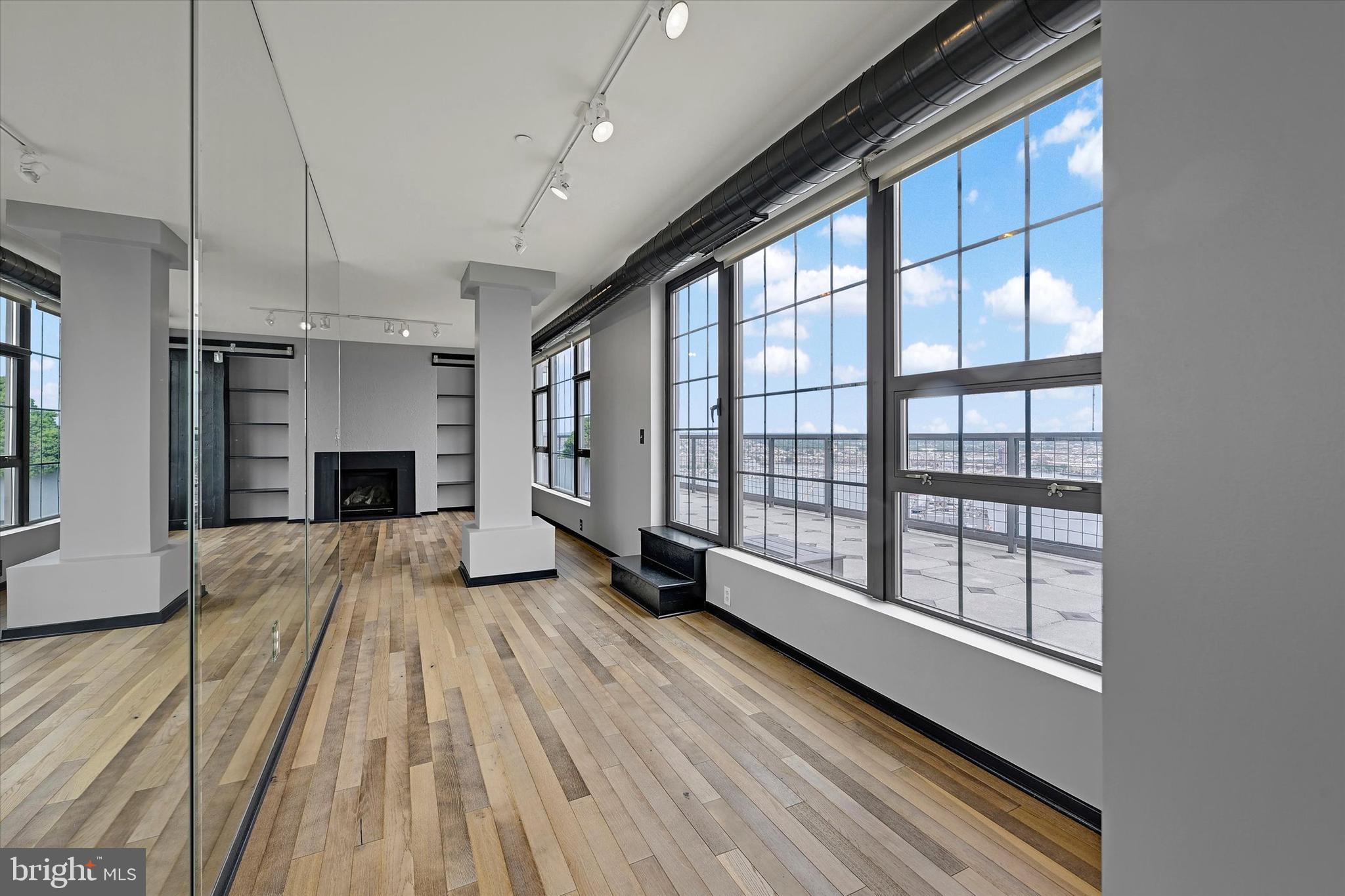 1200 Steuart Street, Unit 1913 Baltimore, MD 21230 - Photo 15 of 94 Glass-wrapped living space.
