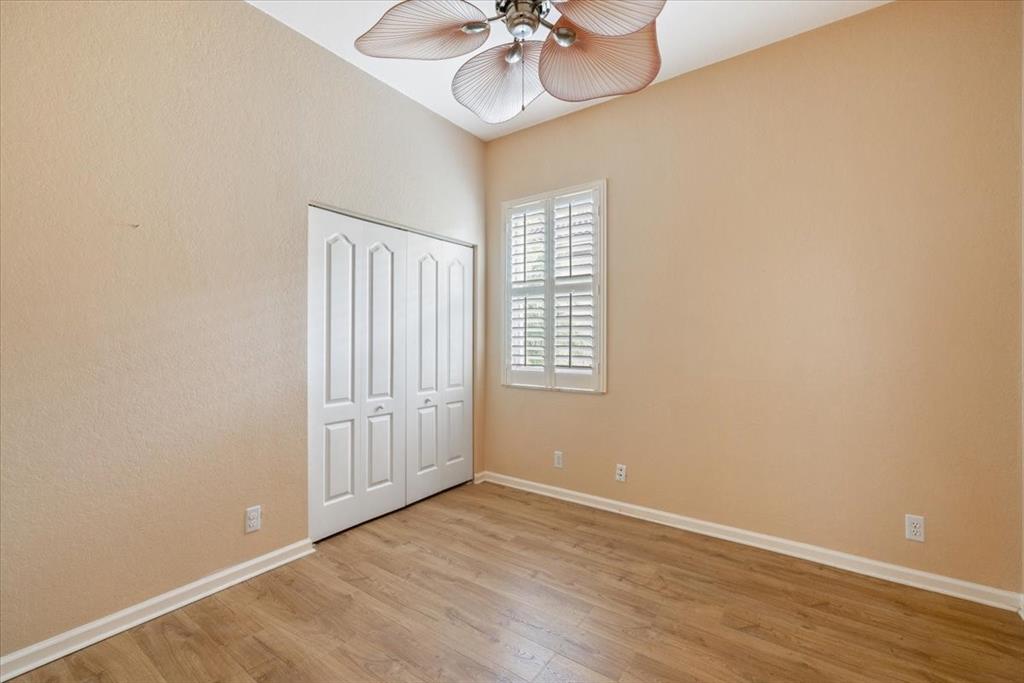 6300 Spring Lake Terrace Fort Pierce, FL 34951 - Photo 14 of 54 wooden floor in an empty room with a window