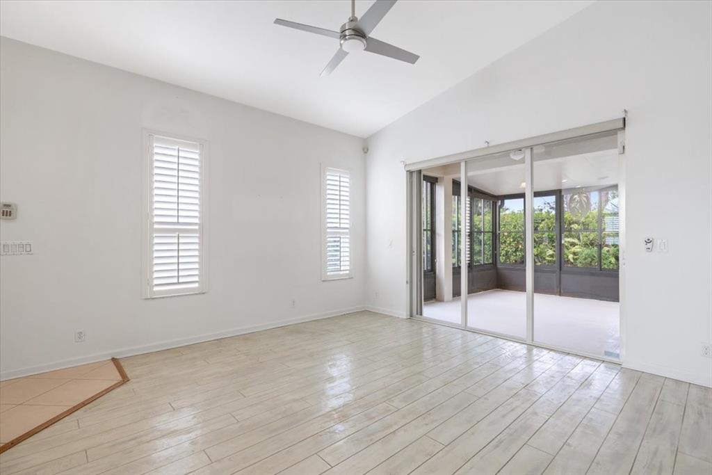 6300 Spring Lake Terrace Fort Pierce, FL 34951 - Photo 16 of 54 a view of an empty room with wooden floor and a window