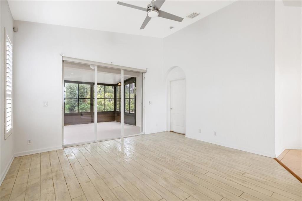 6300 Spring Lake Terrace Fort Pierce, FL 34951 - Photo 17 of 54 wooden floor in an empty room with a window