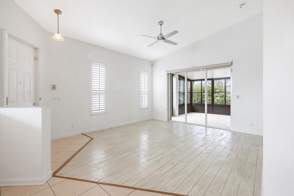 6300 Spring Lake Terrace Fort Pierce, FL 34951 - Photo 22 of 54 a view of an empty room with a window and wooden floor
