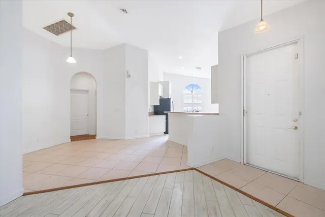 a kitchen with stainless steel appliances a sink stove and cabinets