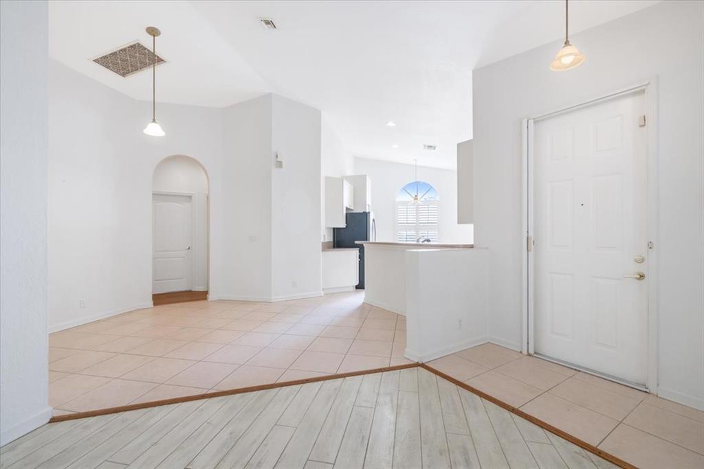 6300 Spring Lake Terrace Fort Pierce, FL 34951 - Photo 24 of 54 a view of empty room with wooden floor and ceiling fan