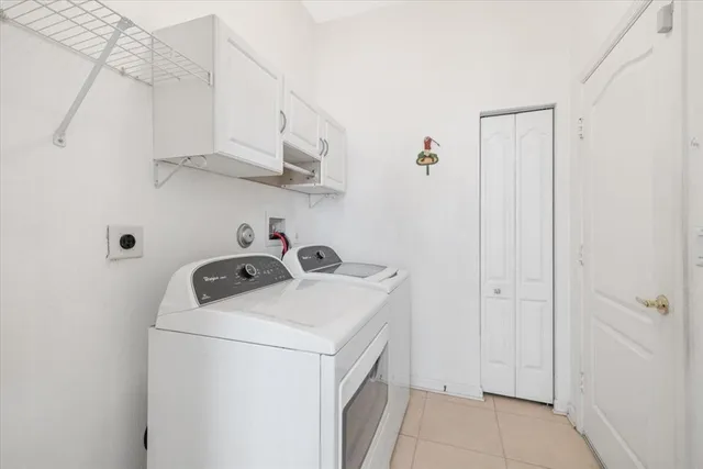 a bedroom with a large bed and a large window