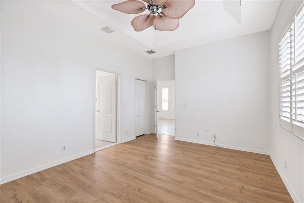 6300 Spring Lake Terrace Fort Pierce, FL 34951 - Photo 4 of 54 wooden floor in an empty room with a window