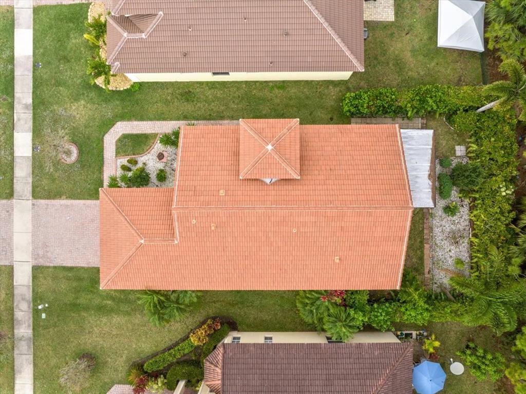 6300 Spring Lake Terrace Fort Pierce, FL 34951 - Photo 47 of 54 an aerial view of a house with a yard and lake view