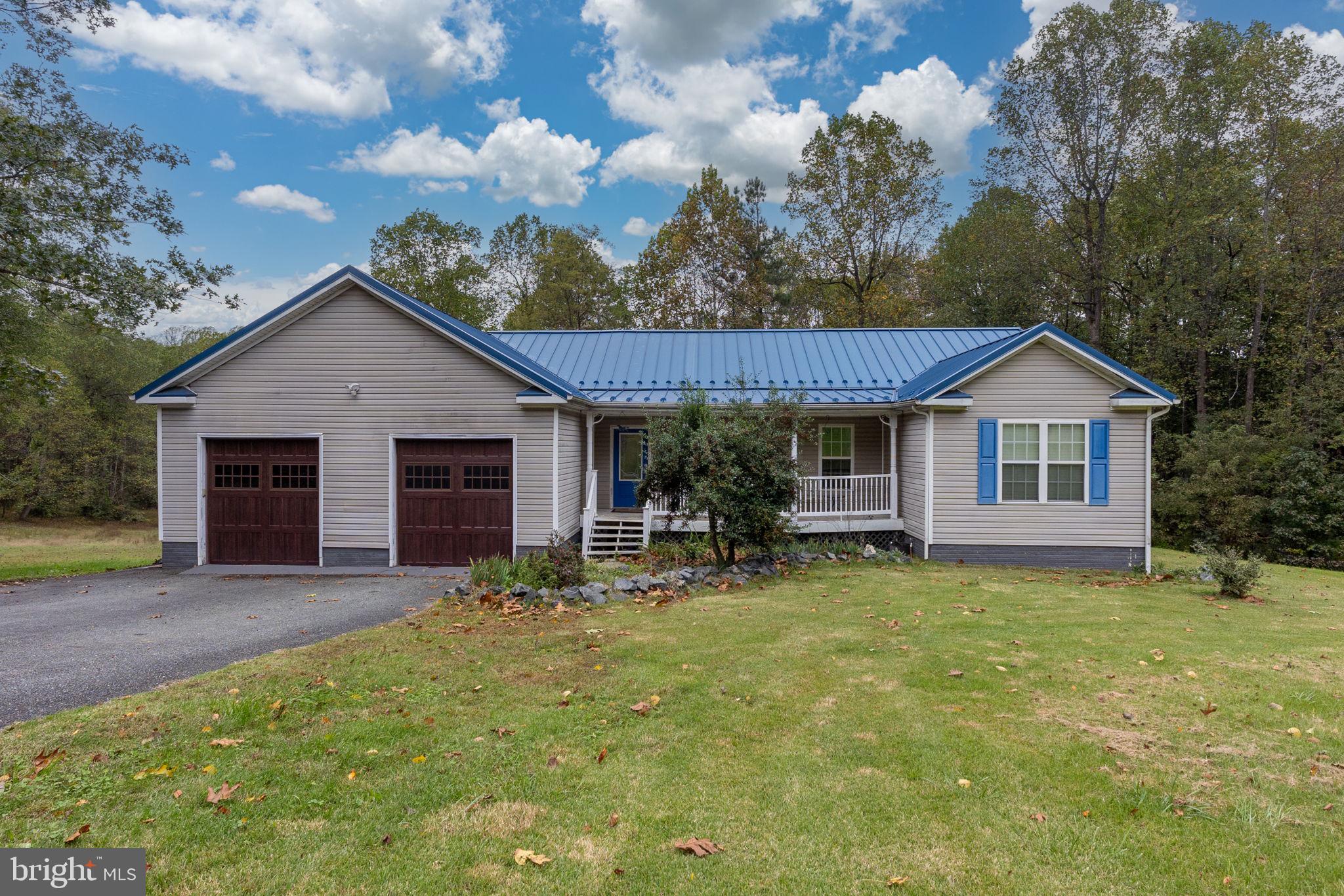 8314 Myrtle Lane King George, VA 22485 - Photo 1 of 40 a front view of house with yard outdoor seating and green space